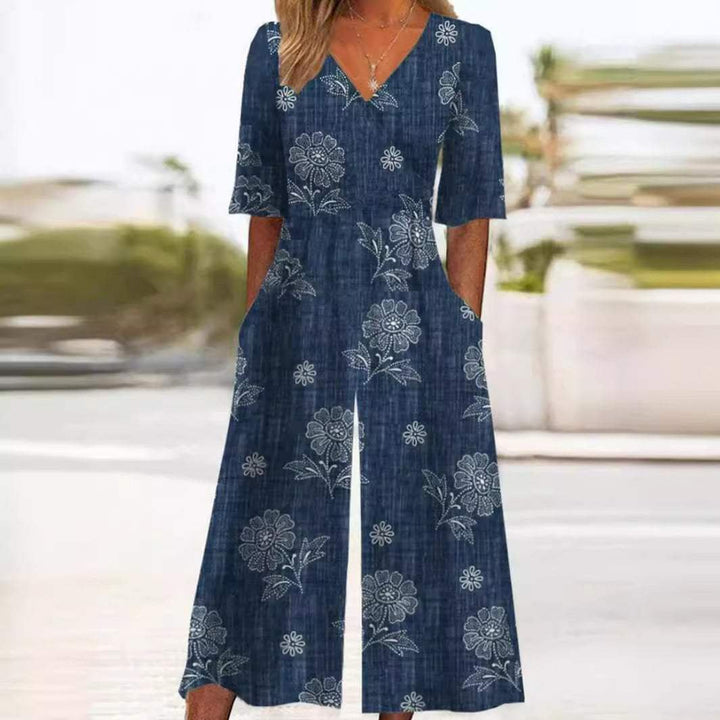 Full shot of a women's boho floral V-neck half-sleeve wide-leg jumpsuit, showcasing its effortless style.