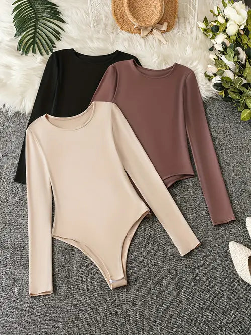 Women's 3-pack long sleeve bodysuits for everyday casual wear. Comfortable stretch fabric, versatile layering.