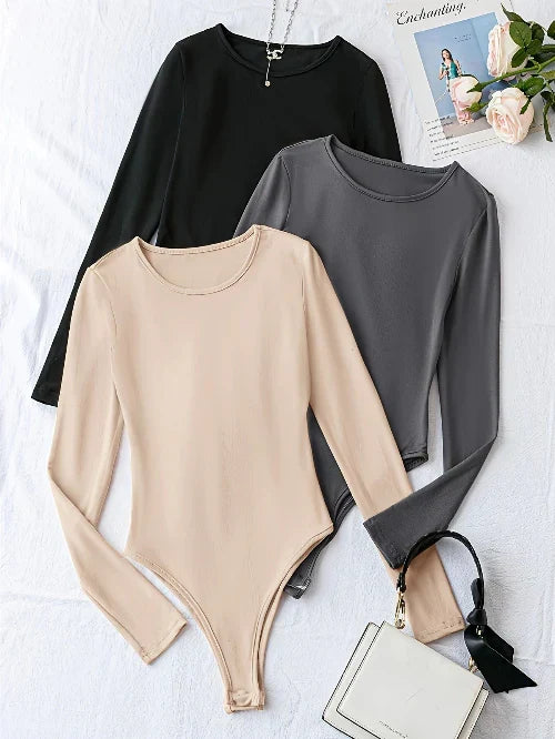 Fashionable women's 3-pack long sleeve bodysuits. Basic crew neck, stretch fabric for comfortable casual style.