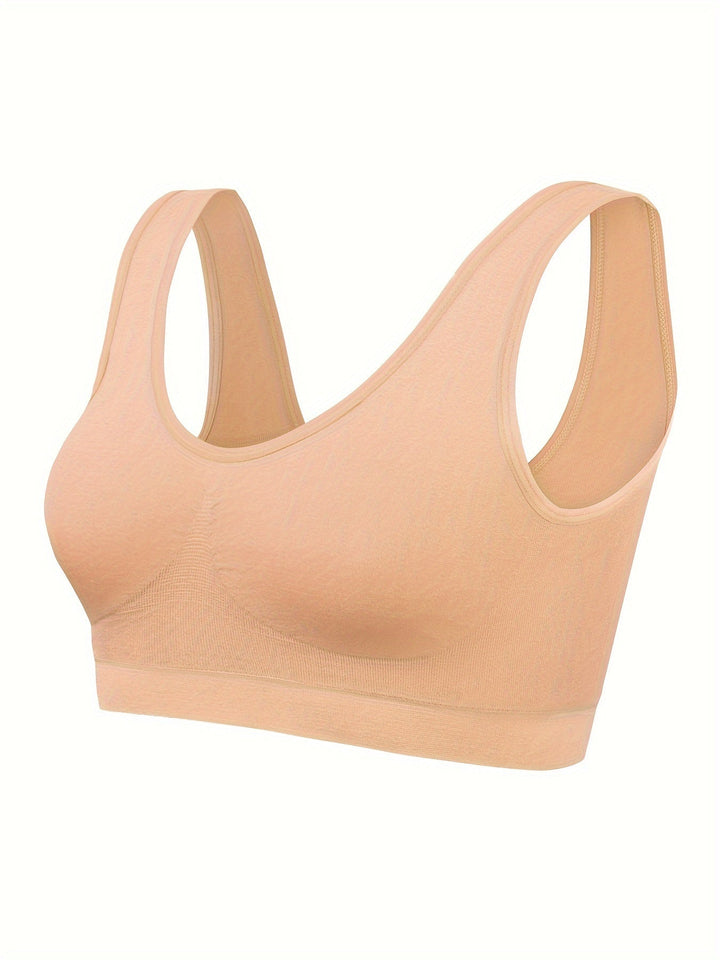 Focus on the seamless design of a women's 3-piece tank top & sports bra set, offering smooth comfort.