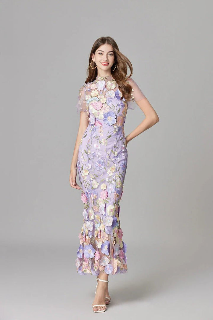 Bodice of an elegant women's sleeveless maxi dress adorned with intricate 3D floral appliqué.