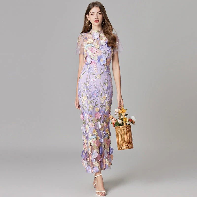 Feminine sleeveless maxi dress featuring intricate 3D floral appliqué, perfect for spring/summer style.