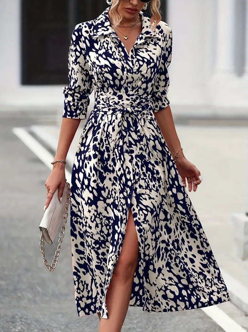 Flowing women's A-line midi dress with a defined waist tie and classic button-down detail, a long versatile dress.