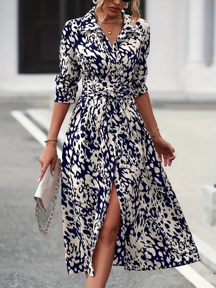 Flowing women's A-line midi dress with a defined waist tie and classic button-down detail, a long versatile dress.