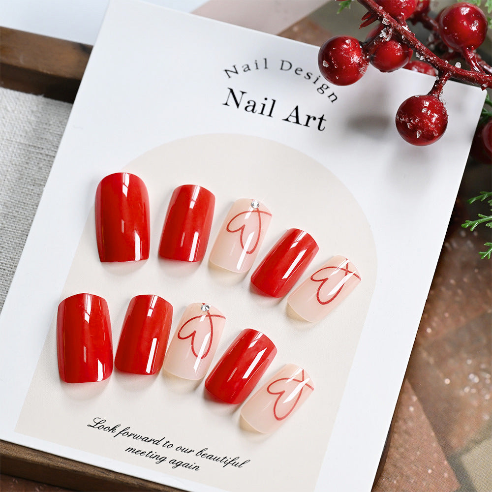 Women's Abstract Heart Press-On Nail Set for stylish DIY manicure; includes fake nails with unique nail art.