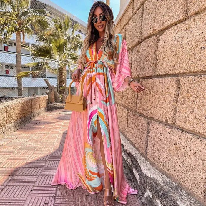 Women's abstract print deep V-neck maxi dress with a stylish tie-waist, perfect for summer fashion.