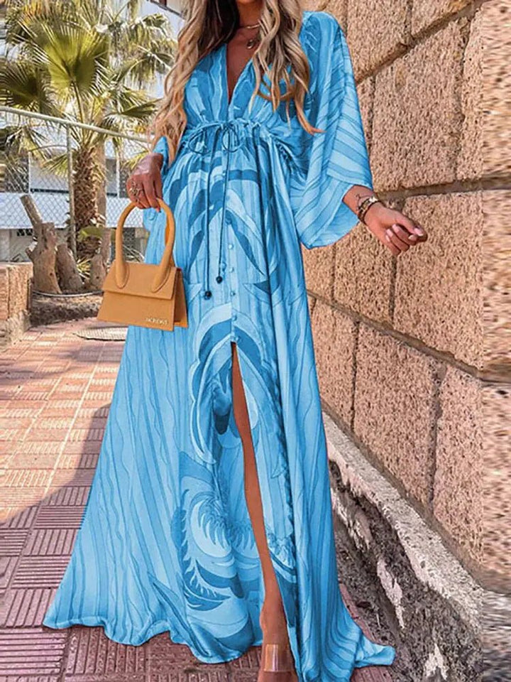 Elegant women's abstract print resort maxi dress featuring a deep V-neck and flowing kimono sleeves.