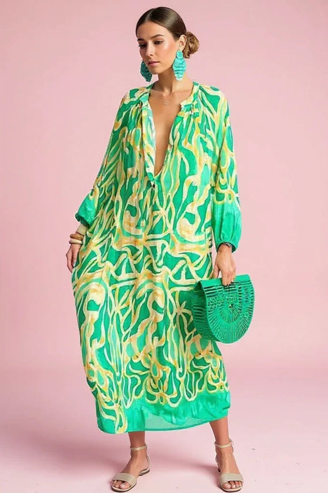 Women's abstract print kaftan maxi dress with a relaxed-fit and V-neck, perfect for summer resort wear.