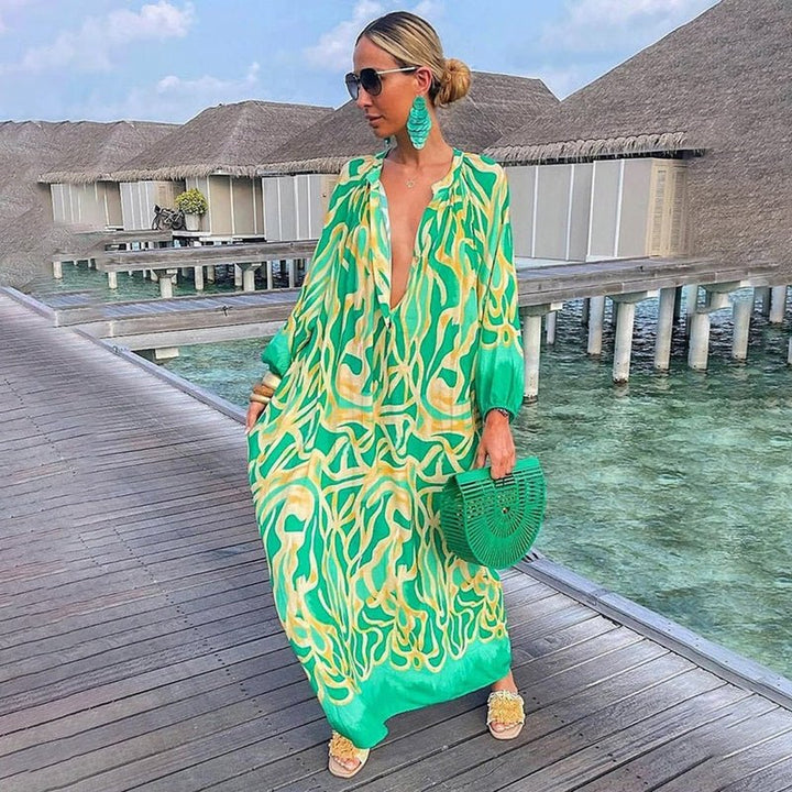 Women's abstract print maxi kaftan dress with plunging V-neck. Effortless bohemian beach cover-up for summer resort.