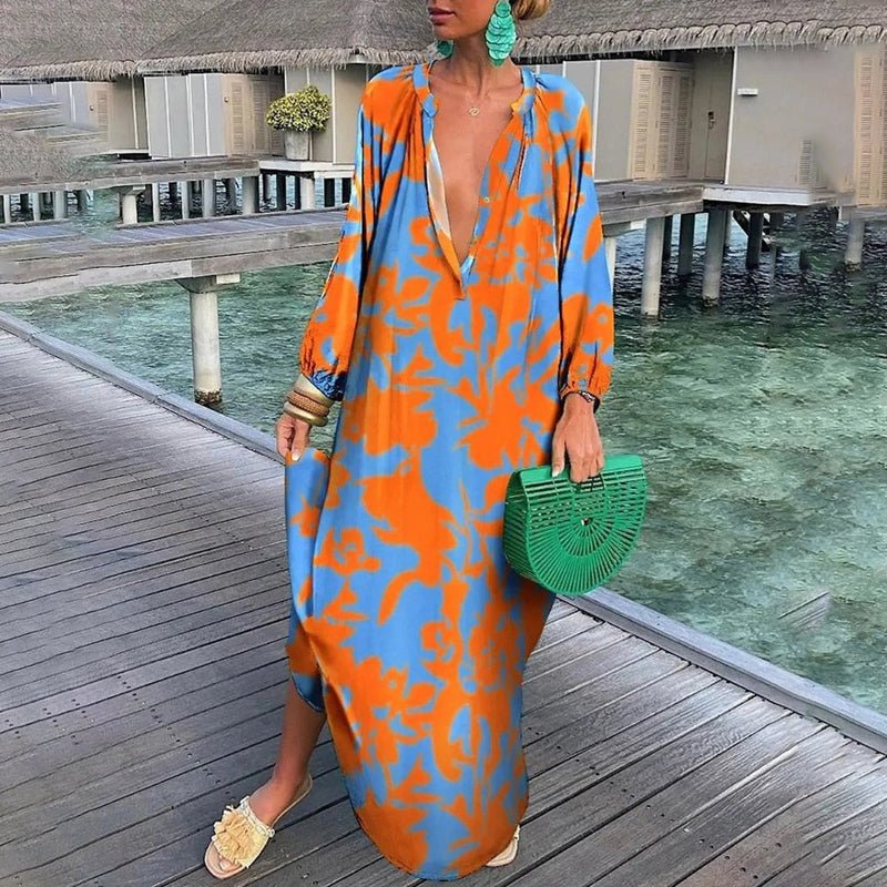 Flowing women's abstract print kaftan maxi dress, perfect as a lightweight beach cover-up or stylish summer holiday wear.