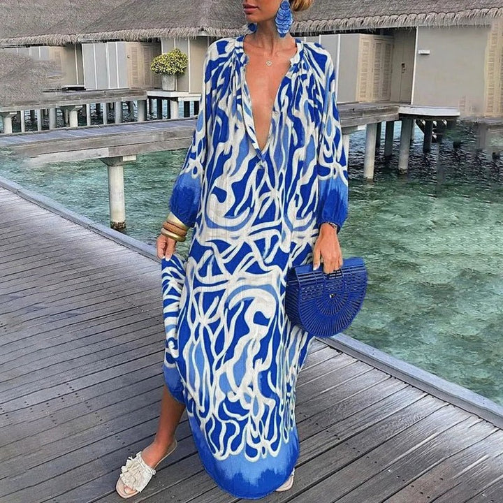 Women's vibrant abstract print maxi kaftan dress. A stylish and comfortable beach cover-up or casual summer dress.
