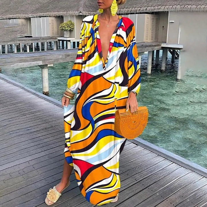 Effortless women's abstract print flowing kaftan dress. A chic maxi length and bohemian design for summer fashion.
