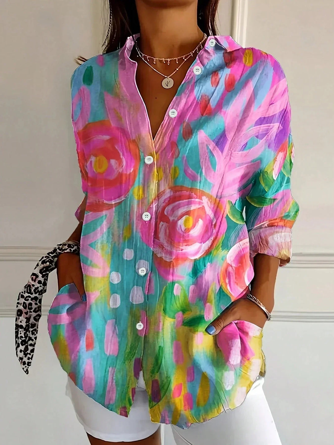 Women's abstract print relaxed fit blouse, perfect for casual summer wear. Vibrant & stylish.