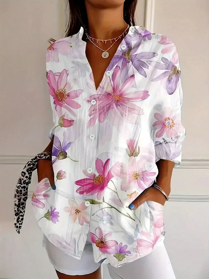 Stylish women's relaxed fit blouse featuring a unique abstract print, ideal for summer fashion.