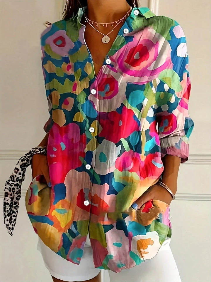 Casual women's blouse, relaxed fit with vibrant abstract print. A versatile day-to-night summer top.