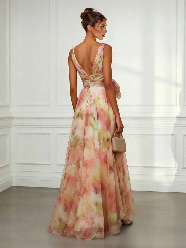 Elegant women's abstract print maxi dress with V-neckline & flattering tie-waist. Ideal as a summer or occasion dress.