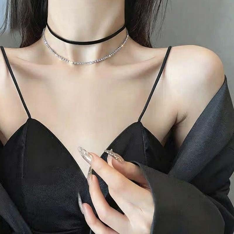 Adjustable black leather choker necklace for women, versatile fit, adds a modern touch to any outfit.