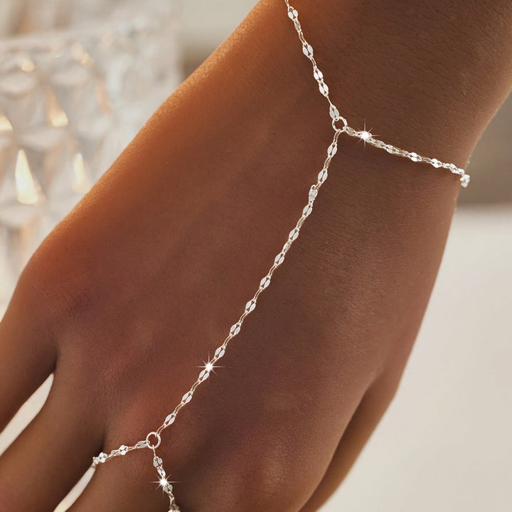 Detailed gold link chain body jewelry for women, an adjustable and versatile accessory for any outfit.