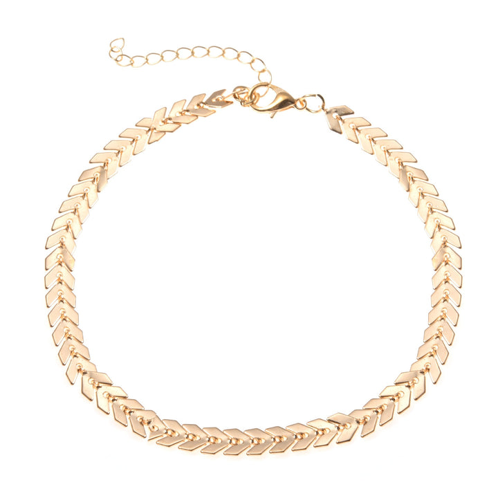 Stylish women's gold herringbone chain anklet, adjustable, an elegant summer accessory for any outfit.