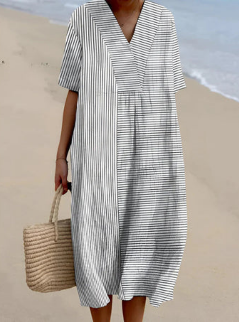 Elegant women's summer dress in an airy, flattering artisan style. A versatile piece for comfortable, day-to-night fashion.