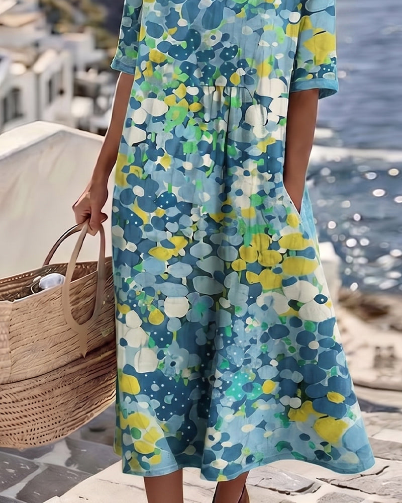 Women's summer floral midi dress, airy fabric and short sleeves, offering casual elegance for holidays.