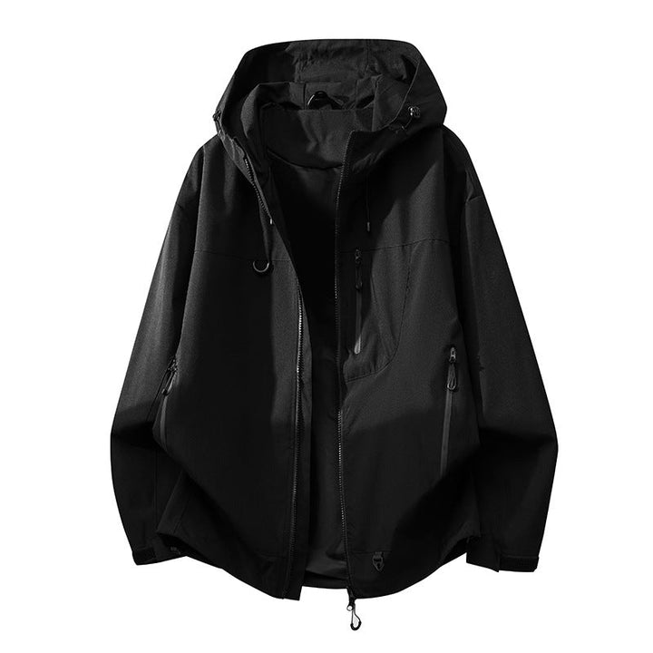 Close-up of secure multi-pockets on a women's technical outdoor jacket, ideal for essentials.