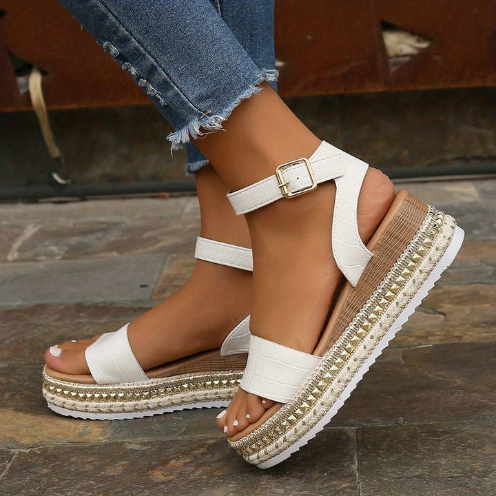 Comfortable women's platform sandals with a secure ankle strap, available in apricot, black & white for summer.