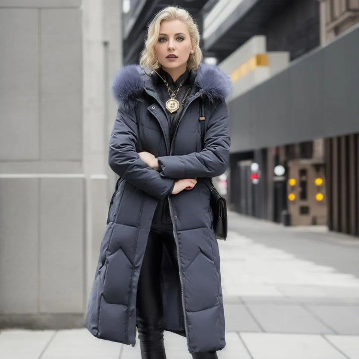 Women's Arctic insulated long parka, hooded with fluffy trim, for stylish winter protection.