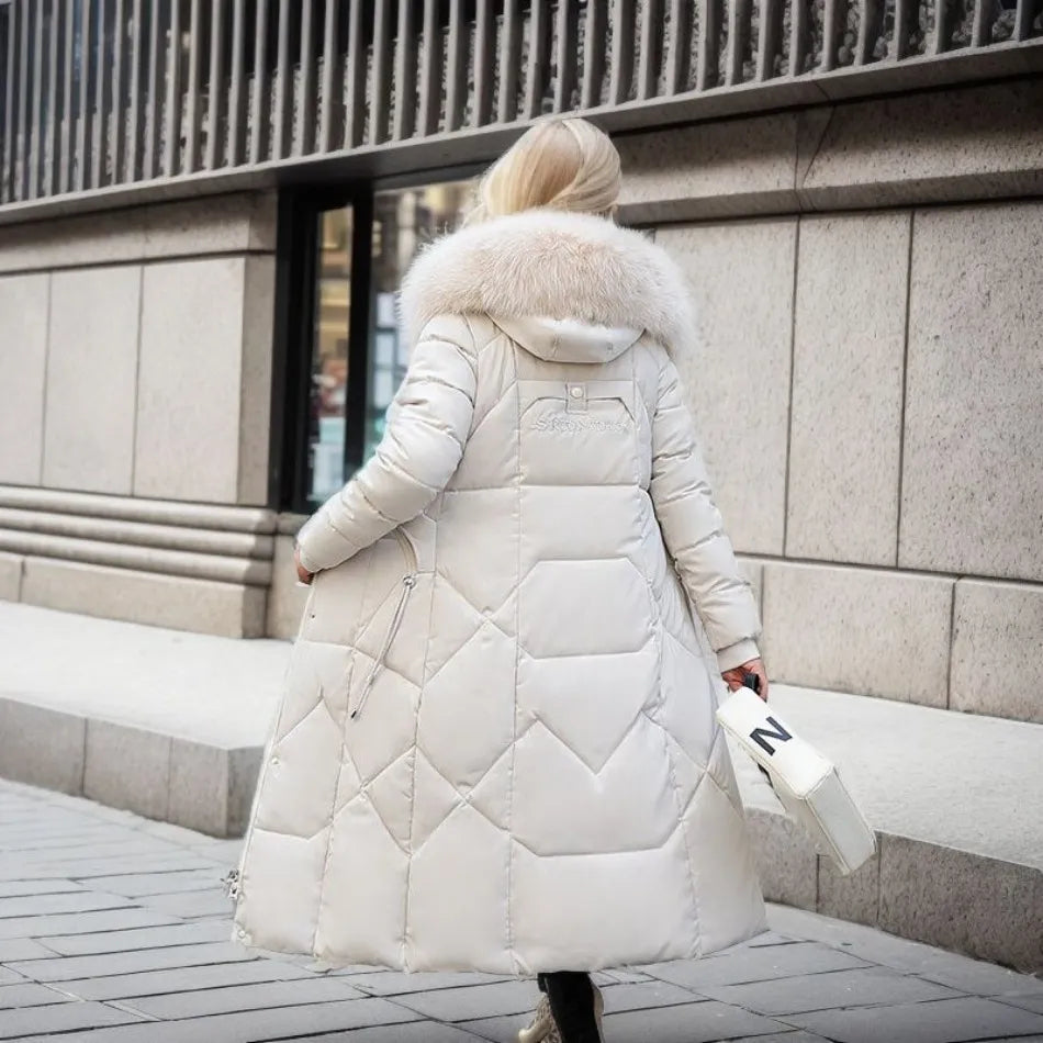 Insulated women's long winter parka, hooded with fluffy trim, for ultimate cold weather warmth.