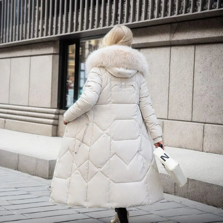 Insulated women's long winter parka, hooded with fluffy trim, for ultimate cold weather warmth.
