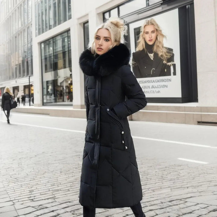 Women's long insulated parka, hooded with soft fluffy trim, ideal for harsh winter fashion.