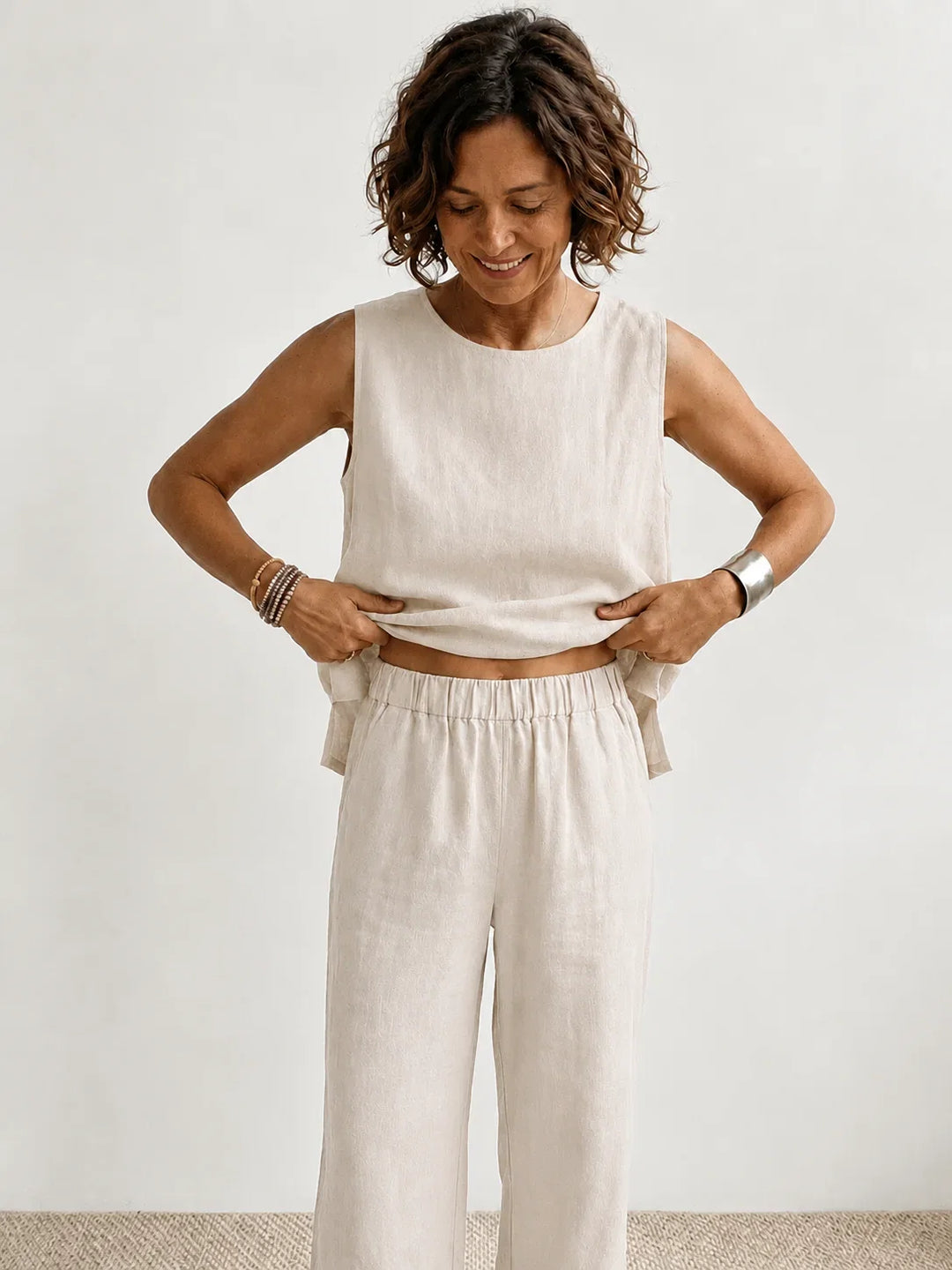 Women's coordinated set in army green: sleeveless top & wide-leg pants. Versatile casual wear.