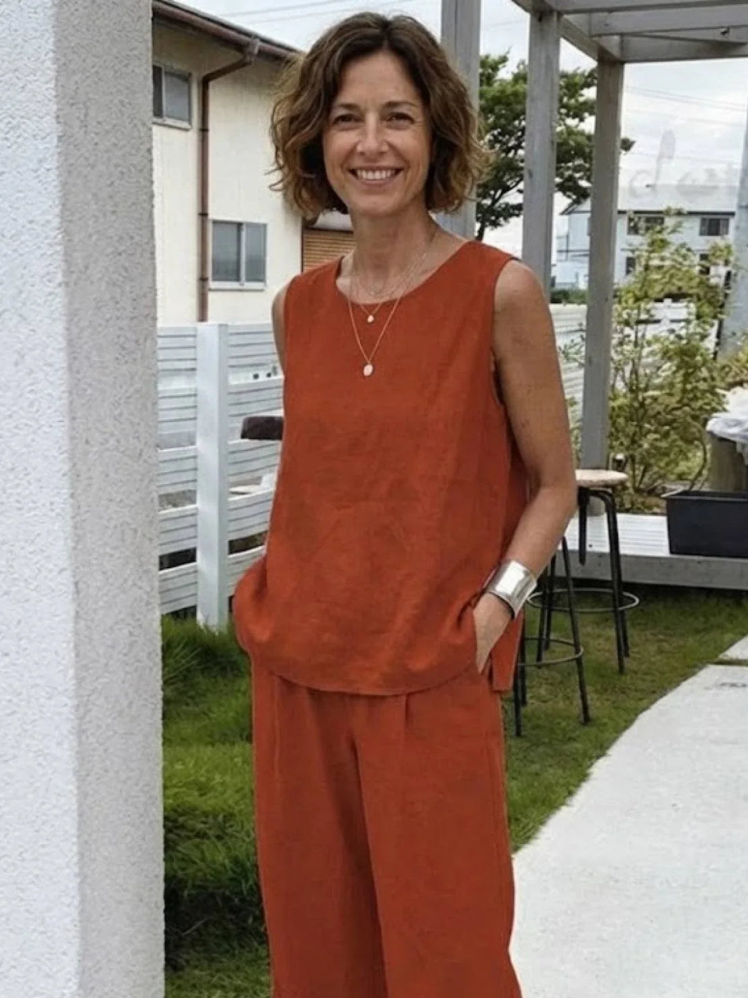 Women's elegant sleeveless top and wide-leg pants set. Coordinated for effortless style.