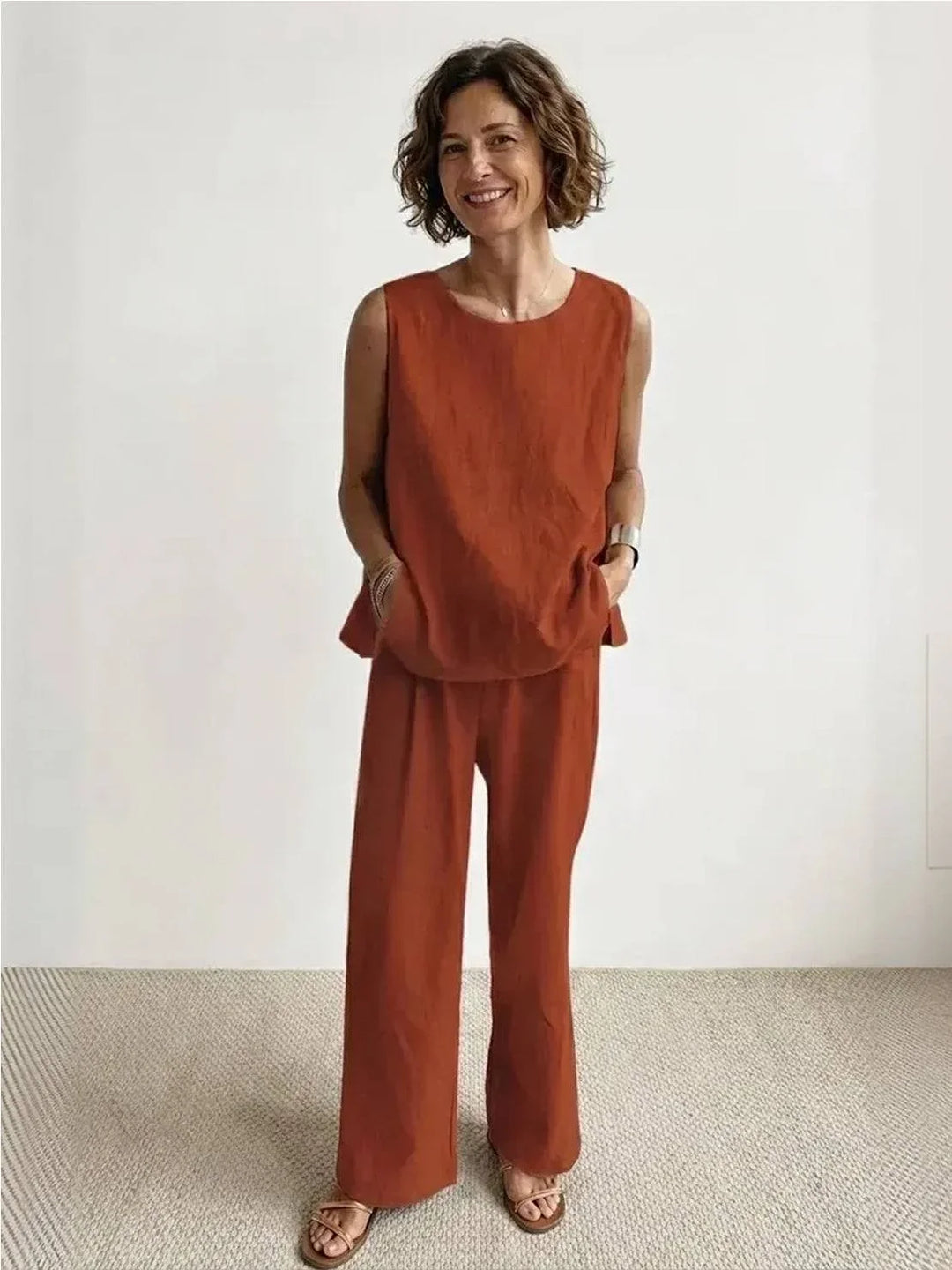Rusty orange women's coordinated set: sleeveless tank & wide-leg pants. Relaxed summer style.