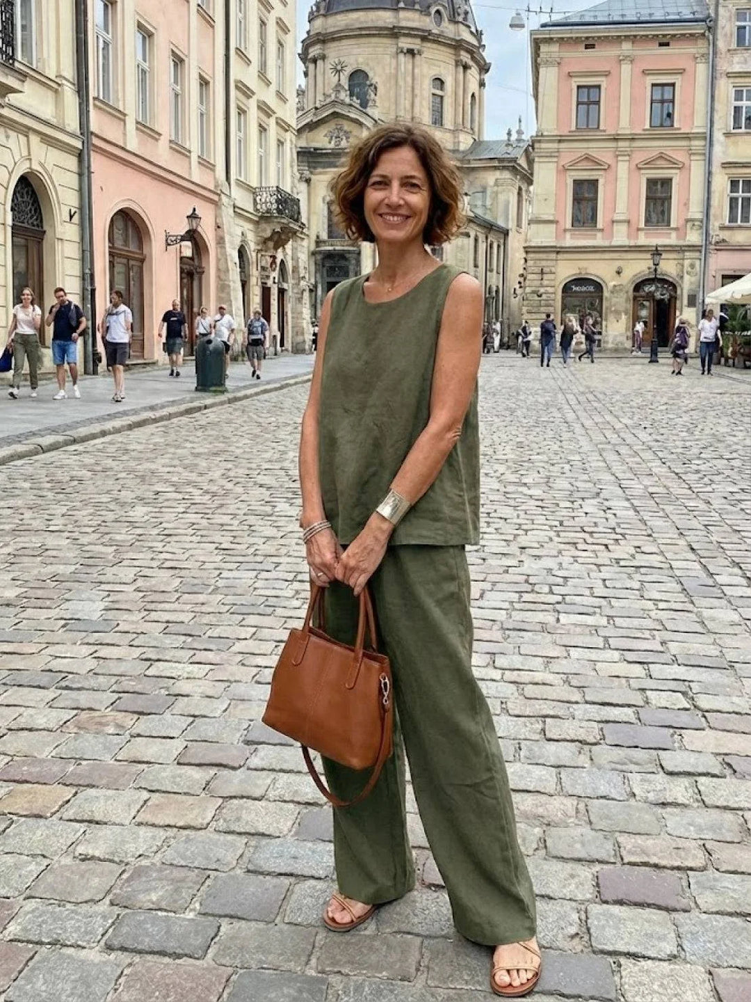 Army green women's matching set: elegant sleeveless blouse & flowy wide-leg pants.