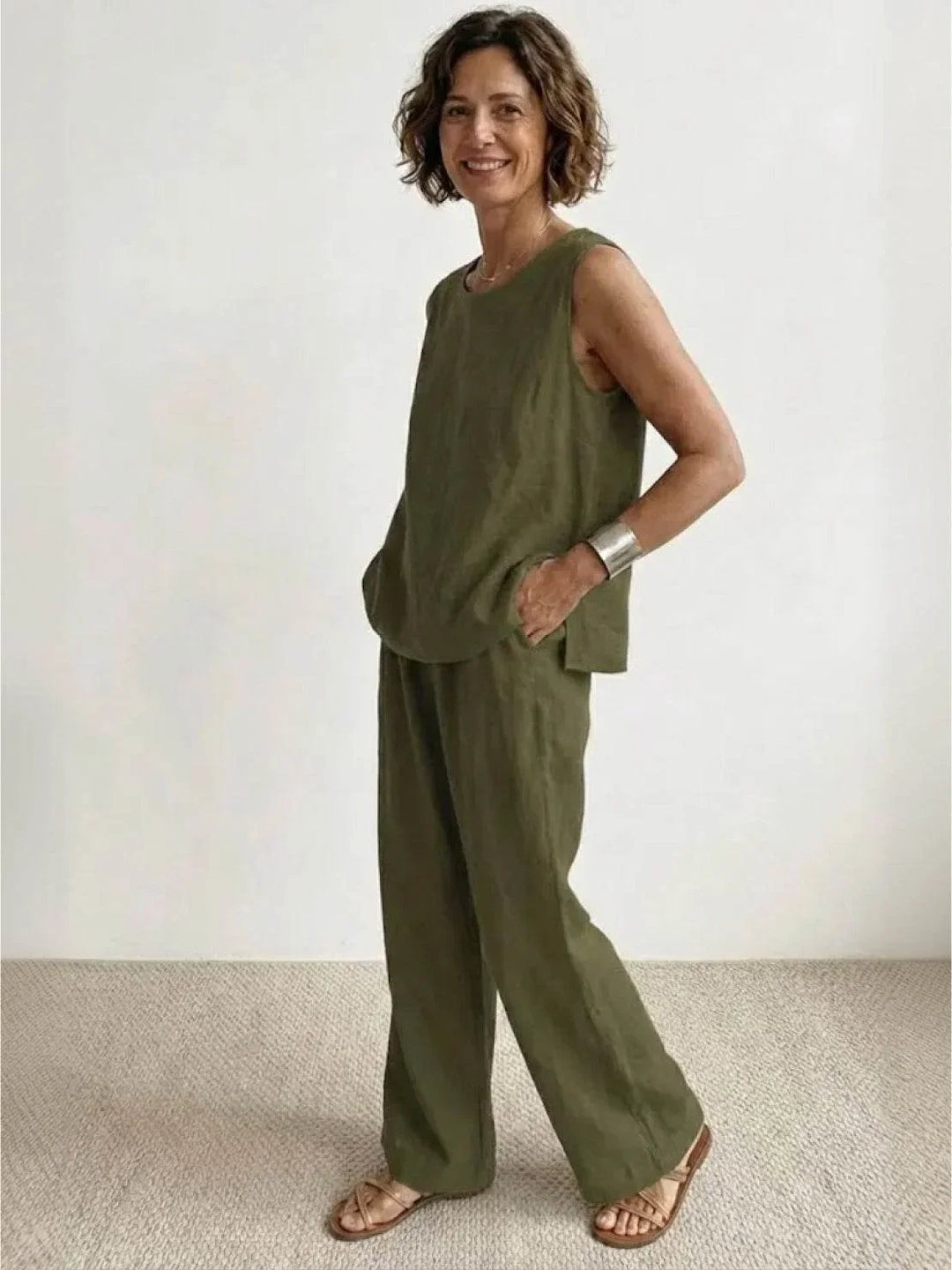 Beige women's casual two-piece outfit: sleeveless tunic & wide-leg trousers. Summer fashion.