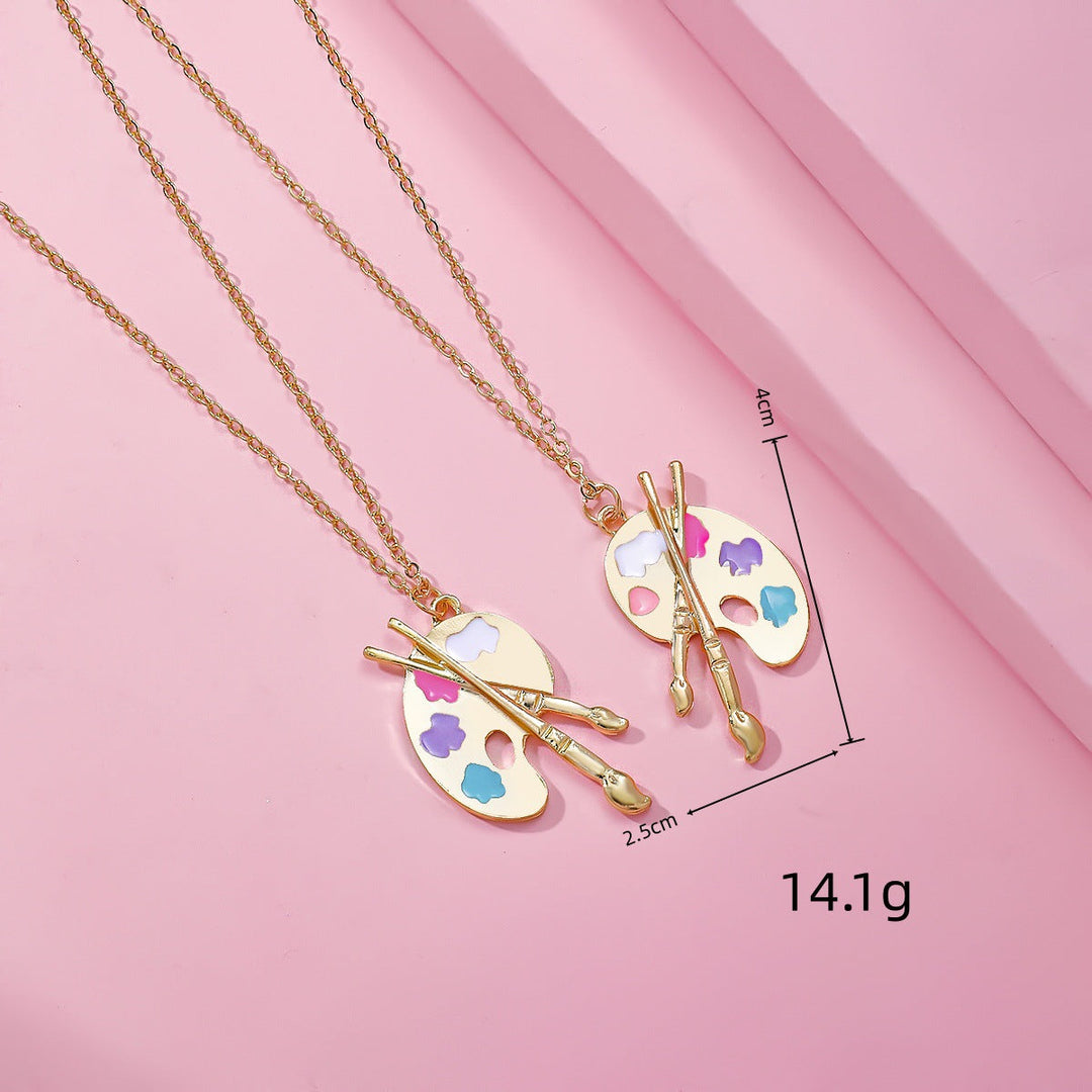 Artist palette & brush necklace presented in a gift box, ideal creative gift for art enthusiasts and women.