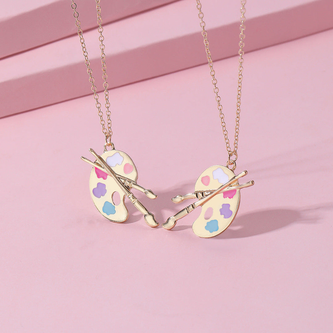Unique women's artist palette and brush pendant necklace, a charming and expressive accessory for art lovers.