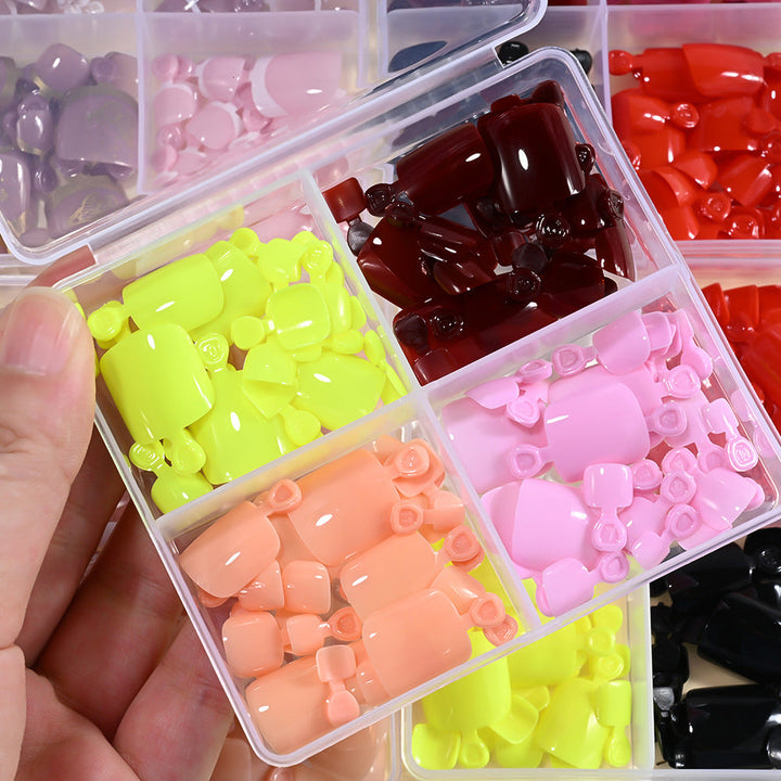 Assorted women's fake nails for DIY beauty. This press-on nail tips set ensures easy application & fashion.
