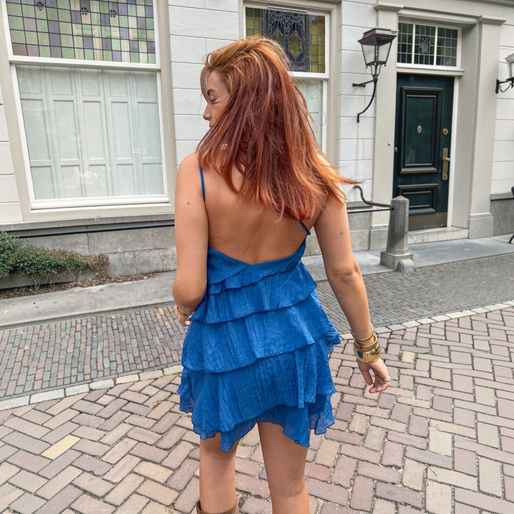 Chic one-shoulder asymmetric mini dress for women, elegant party wear.