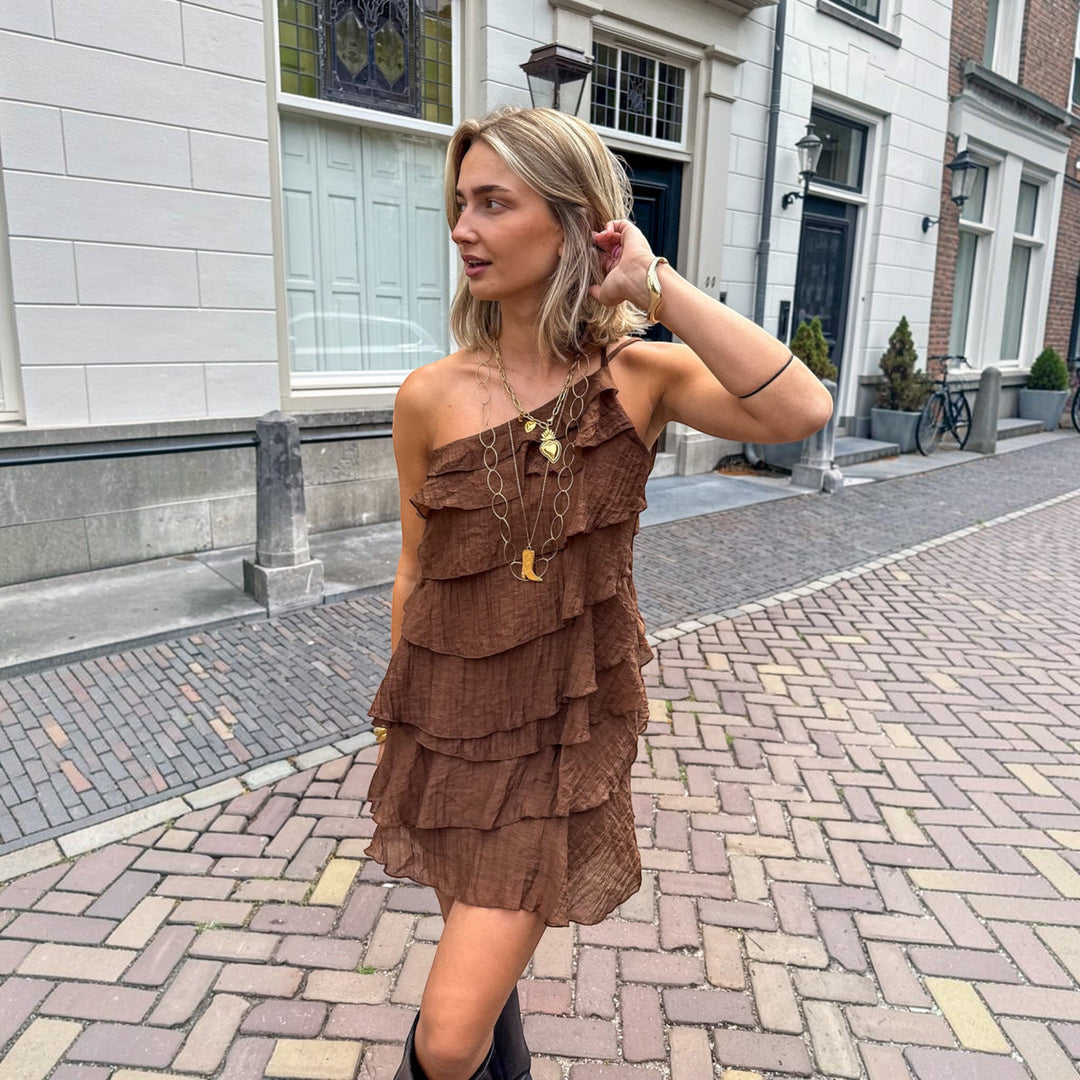 Stylish women's sleeveless mini dress, one-shoulder ruffle design for parties.