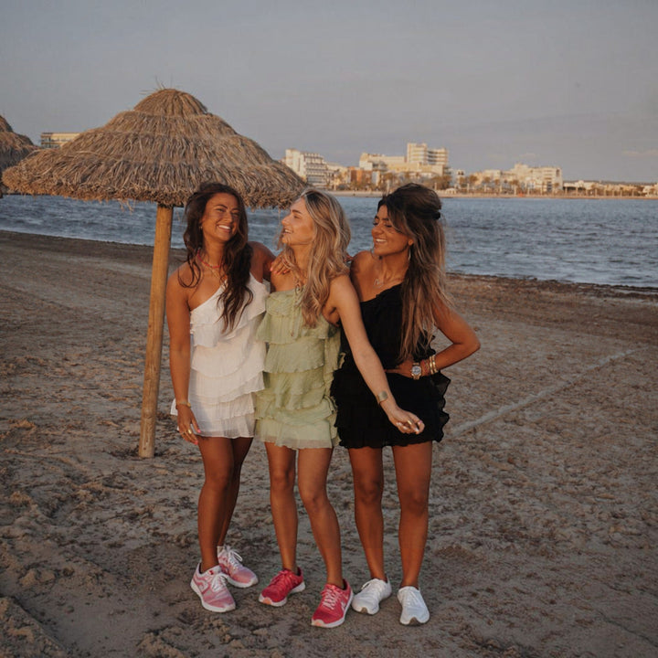 Elegant women's asymmetric mini dress, lightweight ruffle style for vacation.