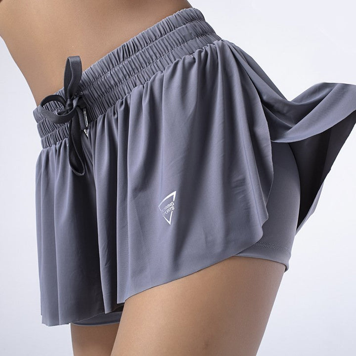 Close-up of the drawstring waist on a women's performance athletic skort with built-in shorts.