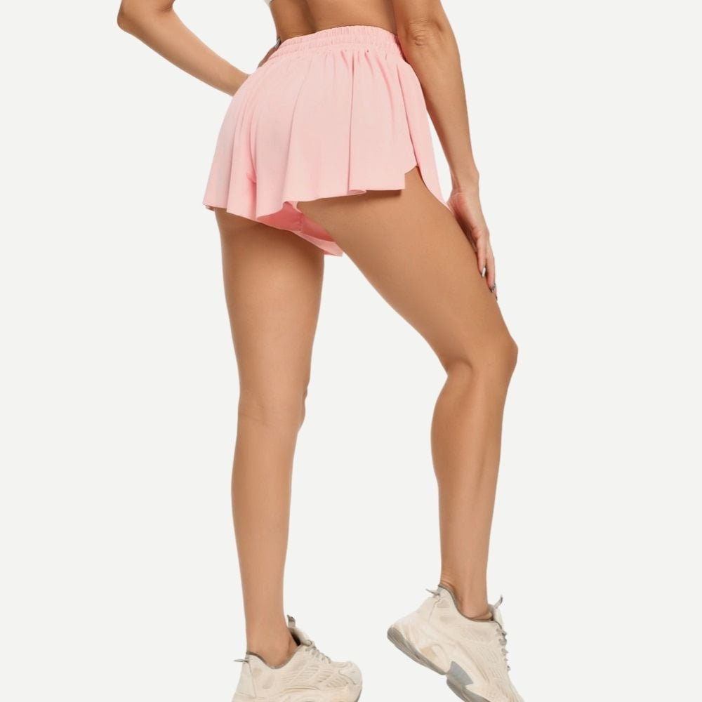 Black women's tennis skirt with built-in shorts. Perfect activewear with adjustable drawstring.