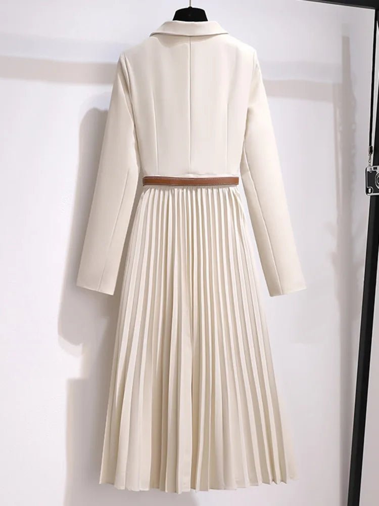 Modern women's blazer-style dress. Beige, with a flattering belt & elegant pleats. Ideal for professional attire.