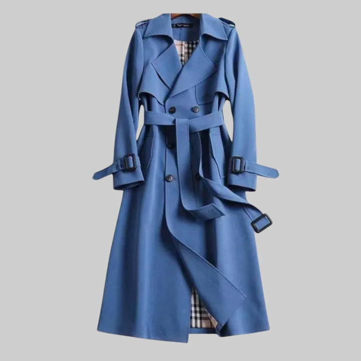 Versatile women's beige long trench coat, double-breasted, offering elegant autumn & spring outerwear.