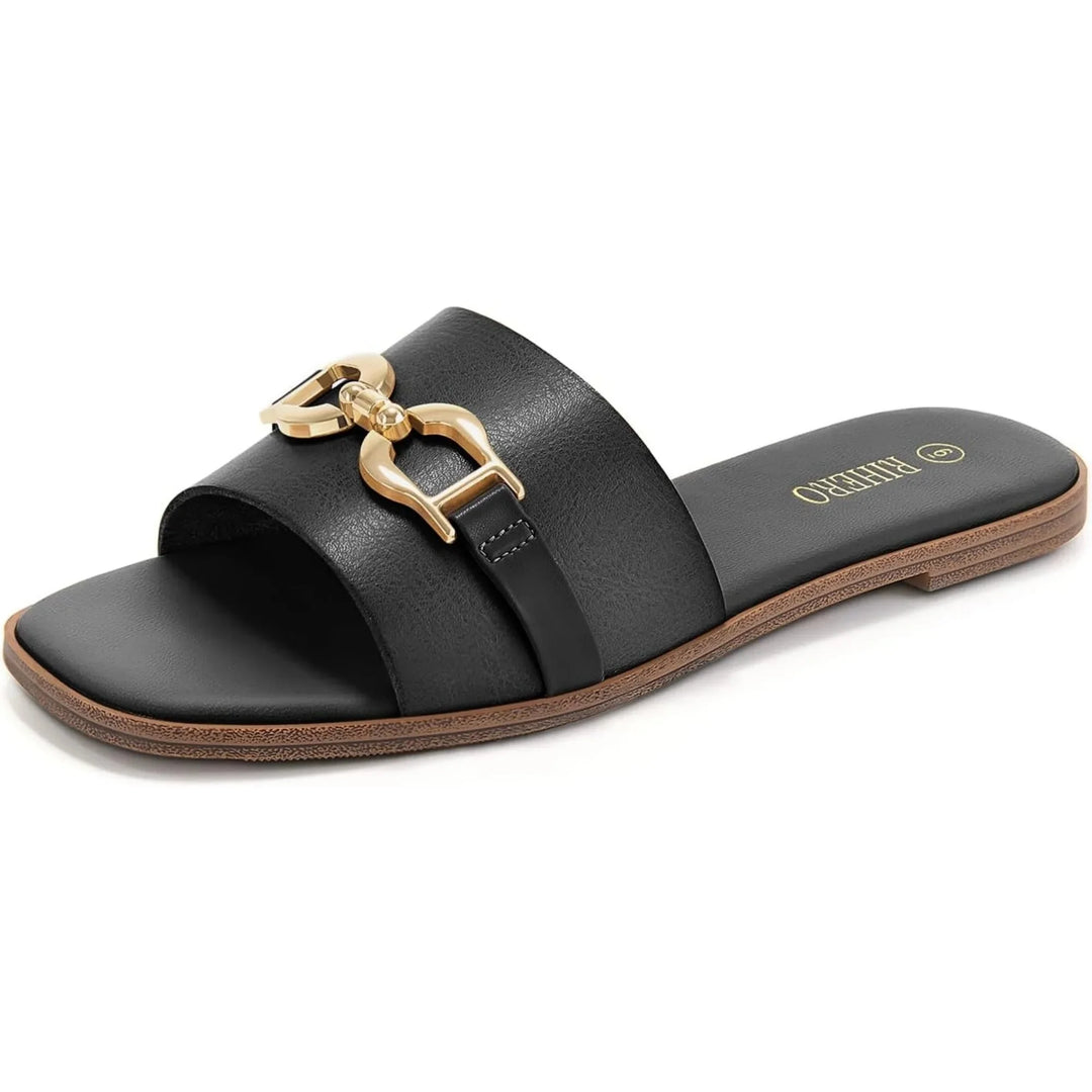 Fashionable women's beige slide sandals with a comfortable flat sole and buckle detail for summer style.