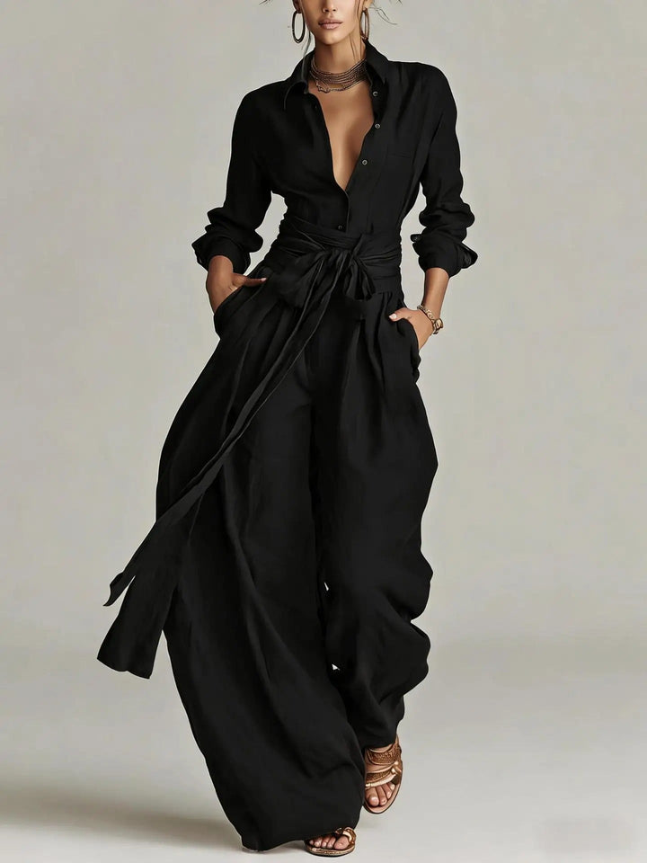 Chic women's belted long-sleeve jumpsuit, ideal for office workwear or elegant day-to-night fashion.