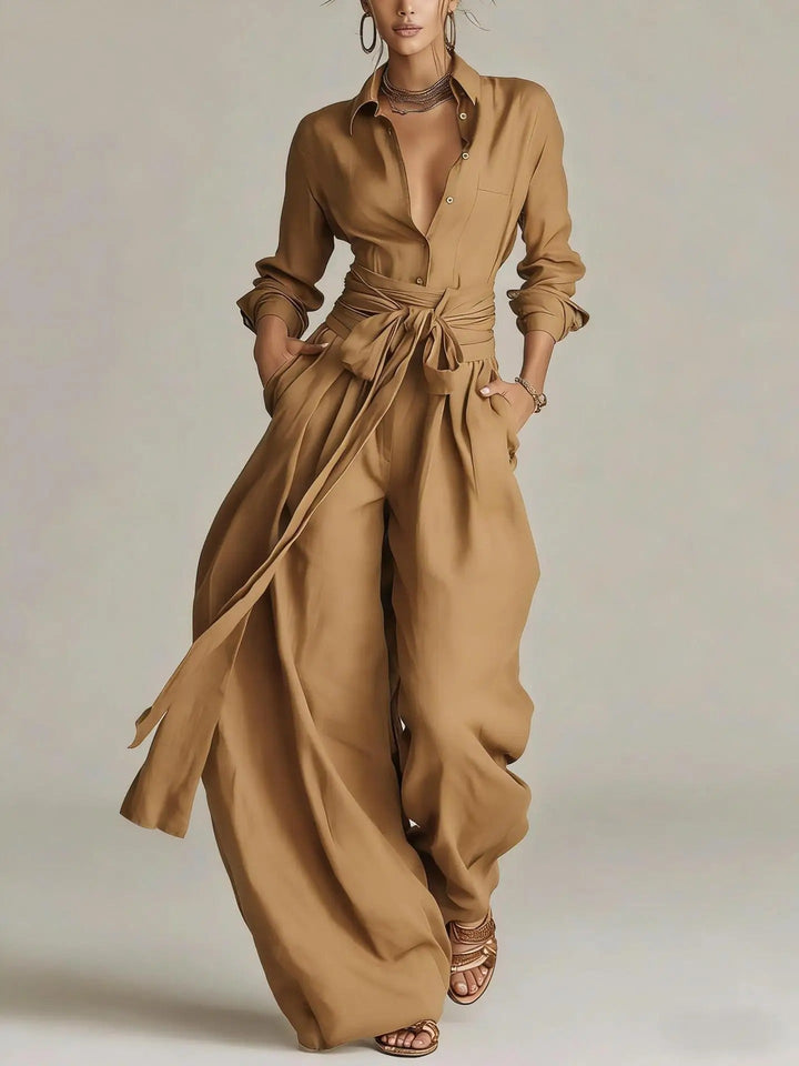 Stylish women's long-sleeve belted jumpsuit, offering a flattering fit for versatile and comfortable wear.