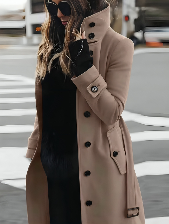 Stylish women's trench coat, belted with high collar. Versatile A-line jacket for sophisticated autumn/winter fashion.